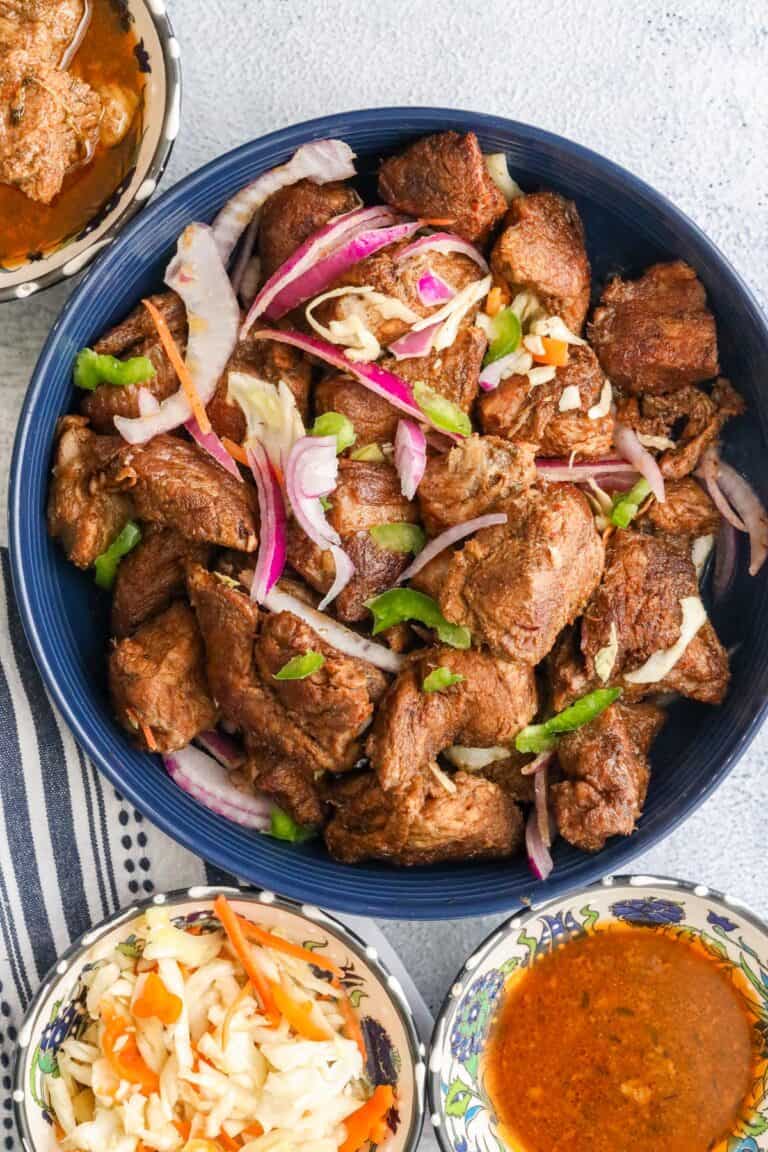 Haitian Fried Pork With Pikliz and sauce on the side