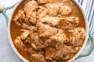 Marinating Haitian griot
