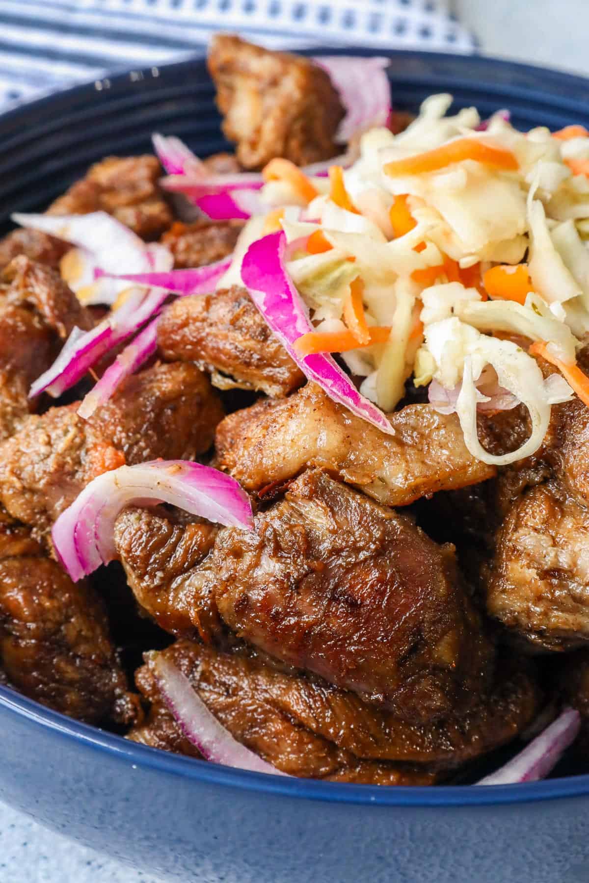 Haitian griot in blue bowl with pikliz