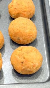 rolled potato balls on rack