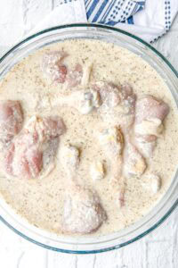 marinating the chicken legs in milk batter