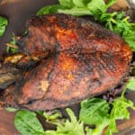 fried turkey breast on wooden board