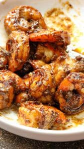 jerked shrimp in white bowl after frying