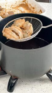 frying black tiger shrimp seasoned with jerk sauce