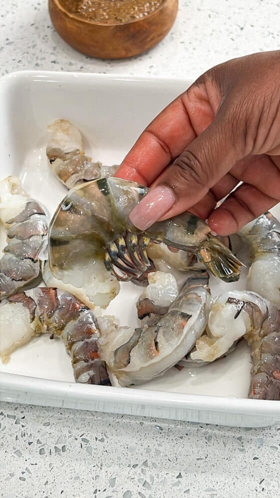 holding tiger shrimp