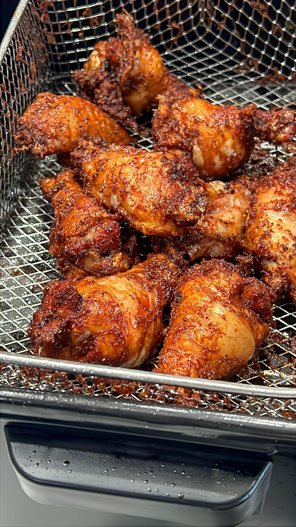 Fried Soy Sauce Garlic Chicken Wings in frying basket