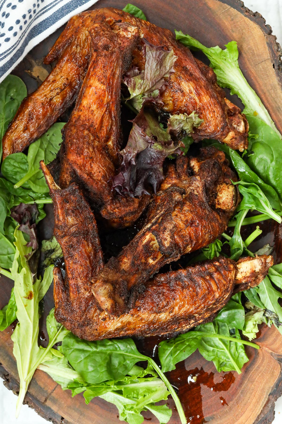 Fried turkey wings on a bed of green leaves
