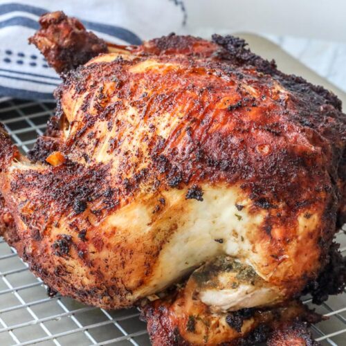 fried whole chicken on cooling rack