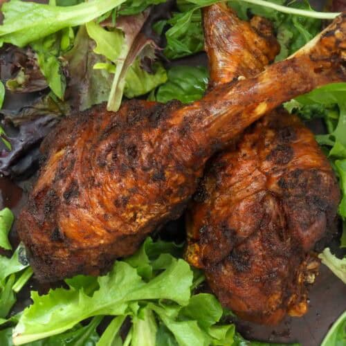 fried turkey legs on wooden board