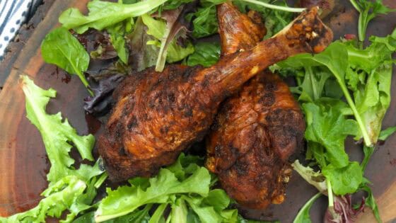 fried turkey legs on wooden board
