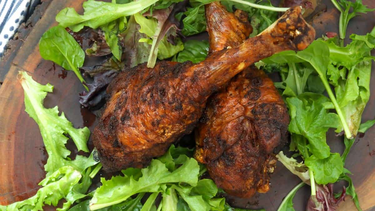 fried turkey legs on wooden board