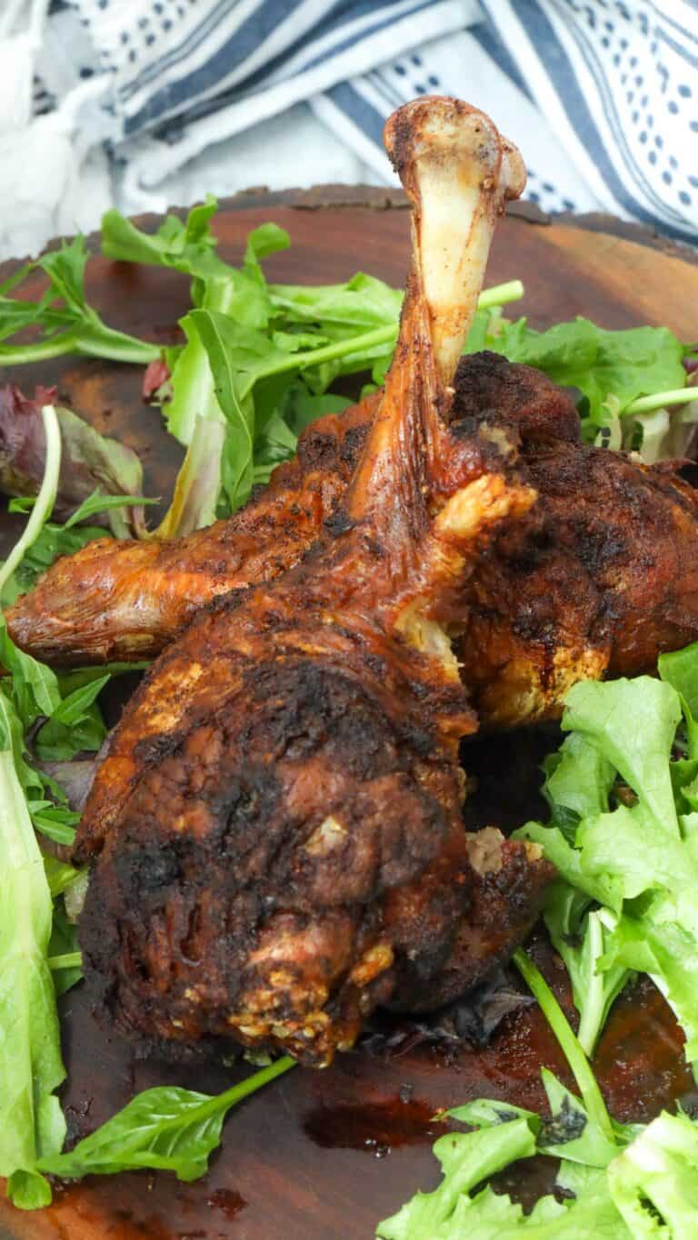 fried turkey legs on wooden board