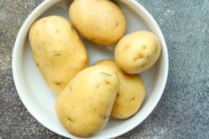 Potatoes on white bowl
