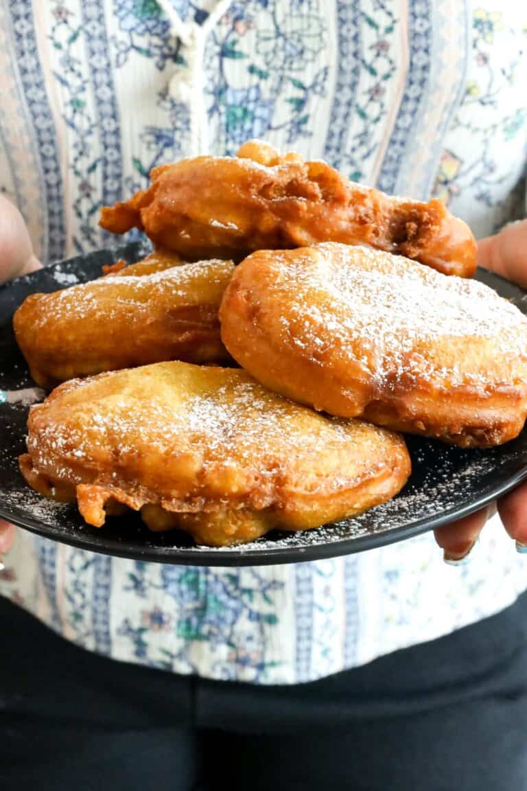 hand holding plate of of honey buns
