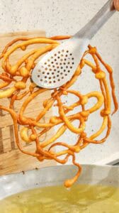 removing funnel cake from the oil
