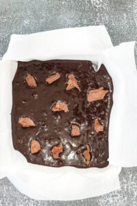 brownie batter topped with chocolate