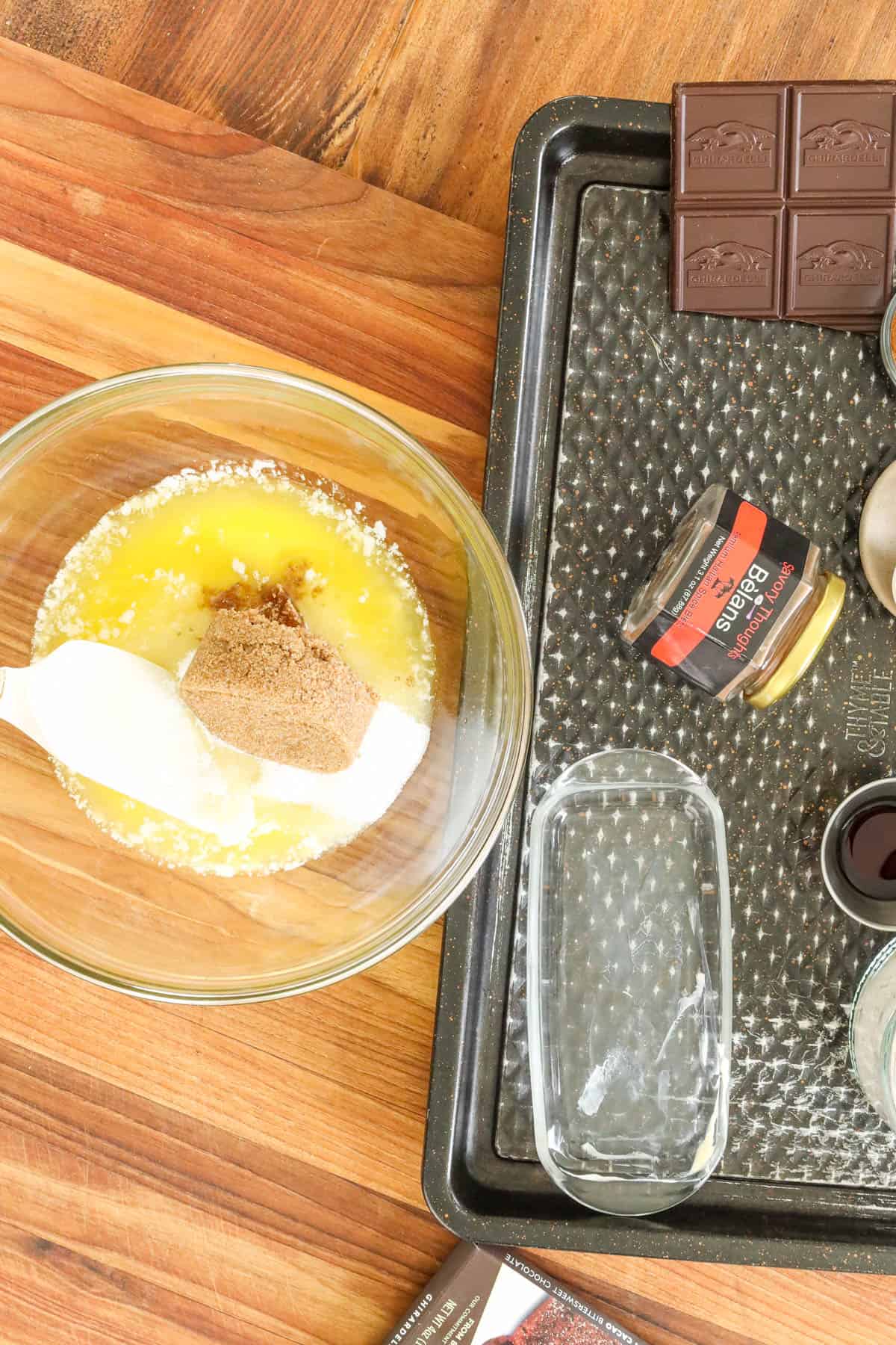 mixing sugar and butter together in glass bowl
