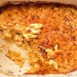 air fryer Mac and cheese in baking dish with a piece missing in the corner