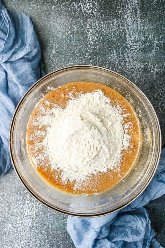 Step-by-step guide to make Air Fryer browned Butter Chocolate Chip Cookies - adding flour to wet ingredients