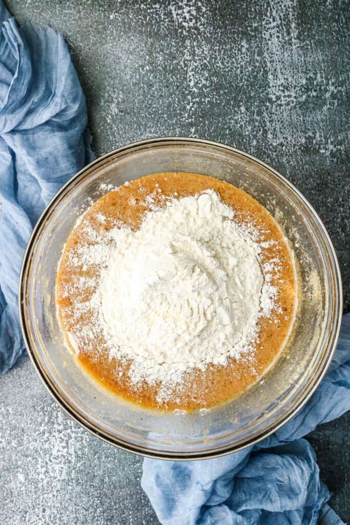 Step-by-step guide to make Air Fryer browned Butter Chocolate Chip Cookies - adding flour to wet ingredients
