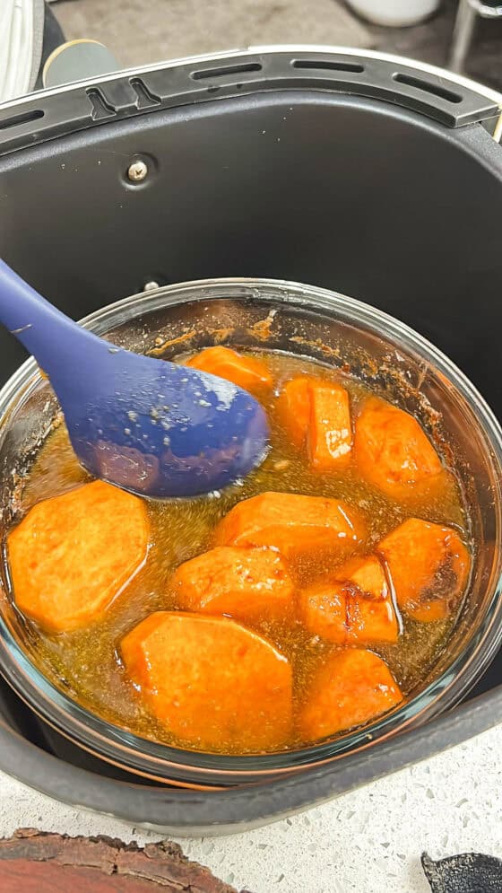 stirring sweet potatoes - weet candied yams