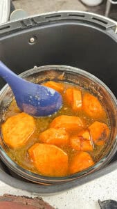 stirring sweet potatoes - weet candied yams