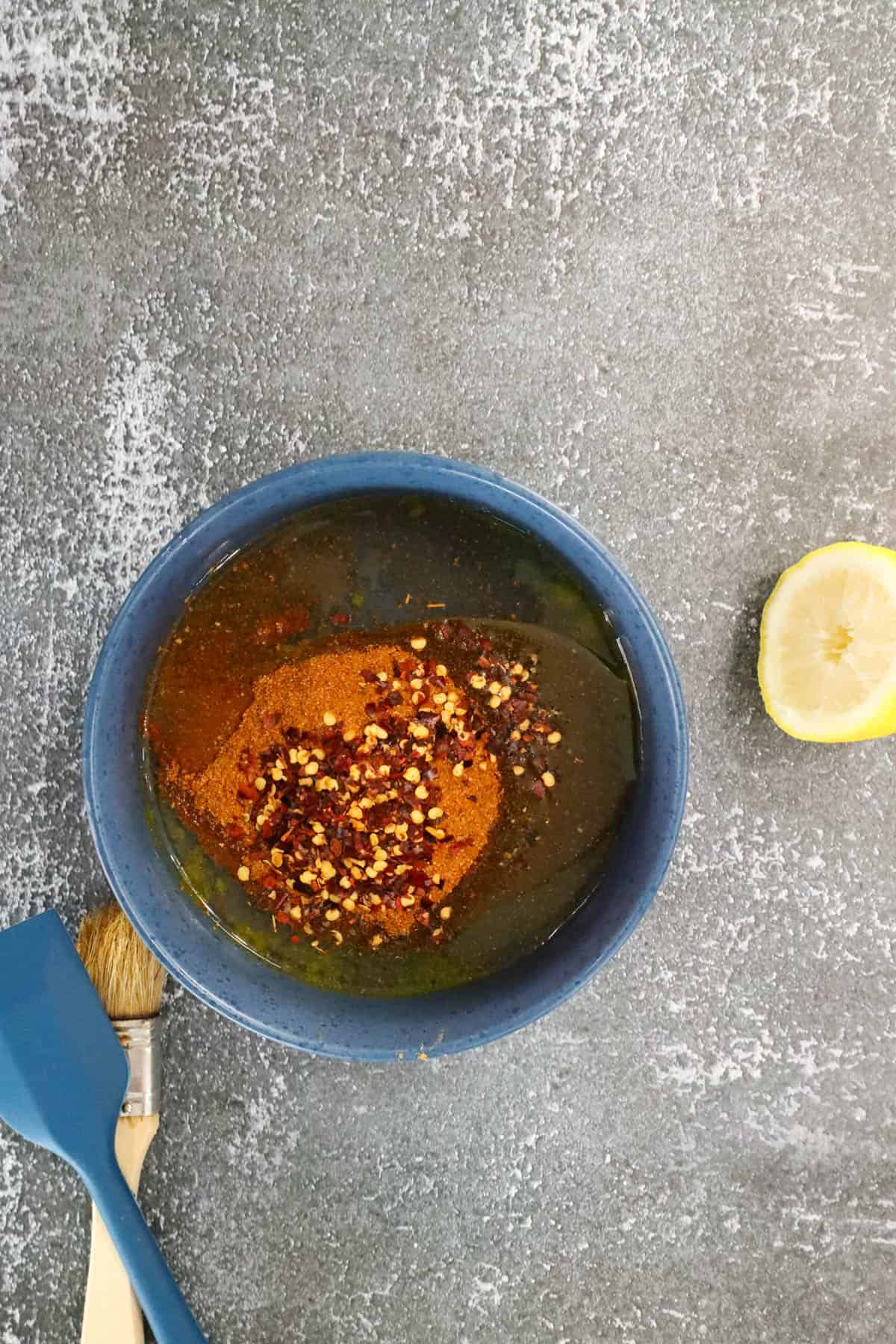 mixing seasoning in blue bowl