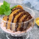 the best homemade fried ice cream topped with chocolate syrup and garnished with mint leaves