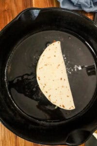 frying tacos in skillet