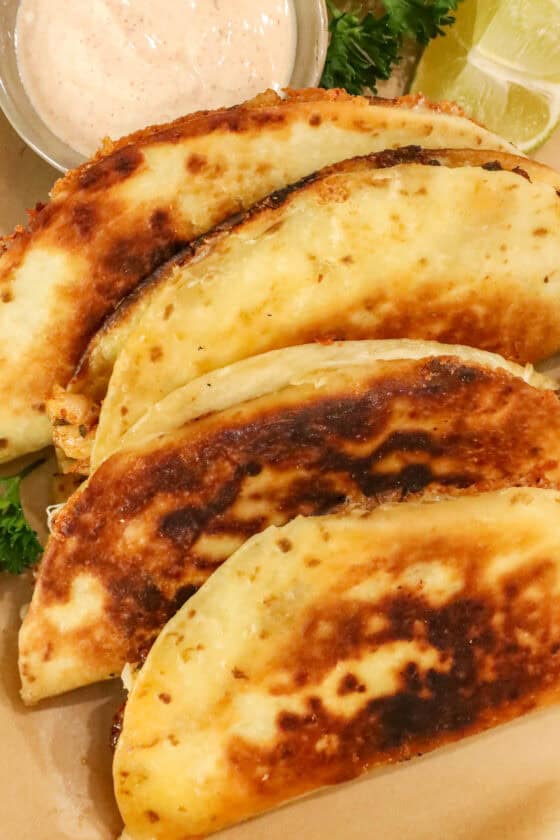 Fried Tacos Recipe Stacked on plate