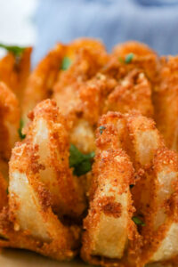 golden crispy Copycat Bloomin Onion topped with fresh parsley