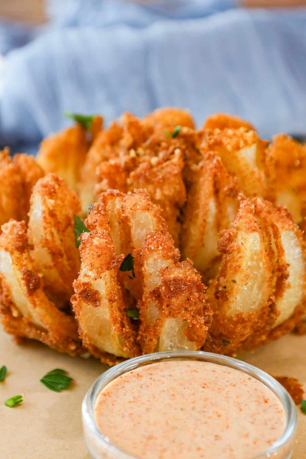 Deep Fried Copycat Bloomin Onion with dipping sauce