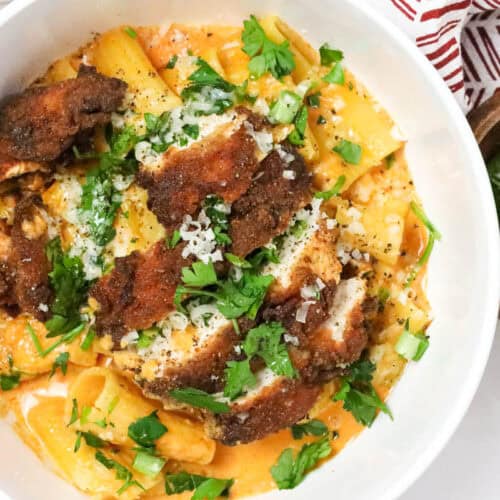 Delicious Gochujang Chicken Breast Recipe over a bed of gochujang pasta