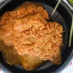 country fried steak in black bowl