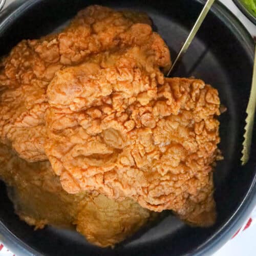 country fried steak in black bowl