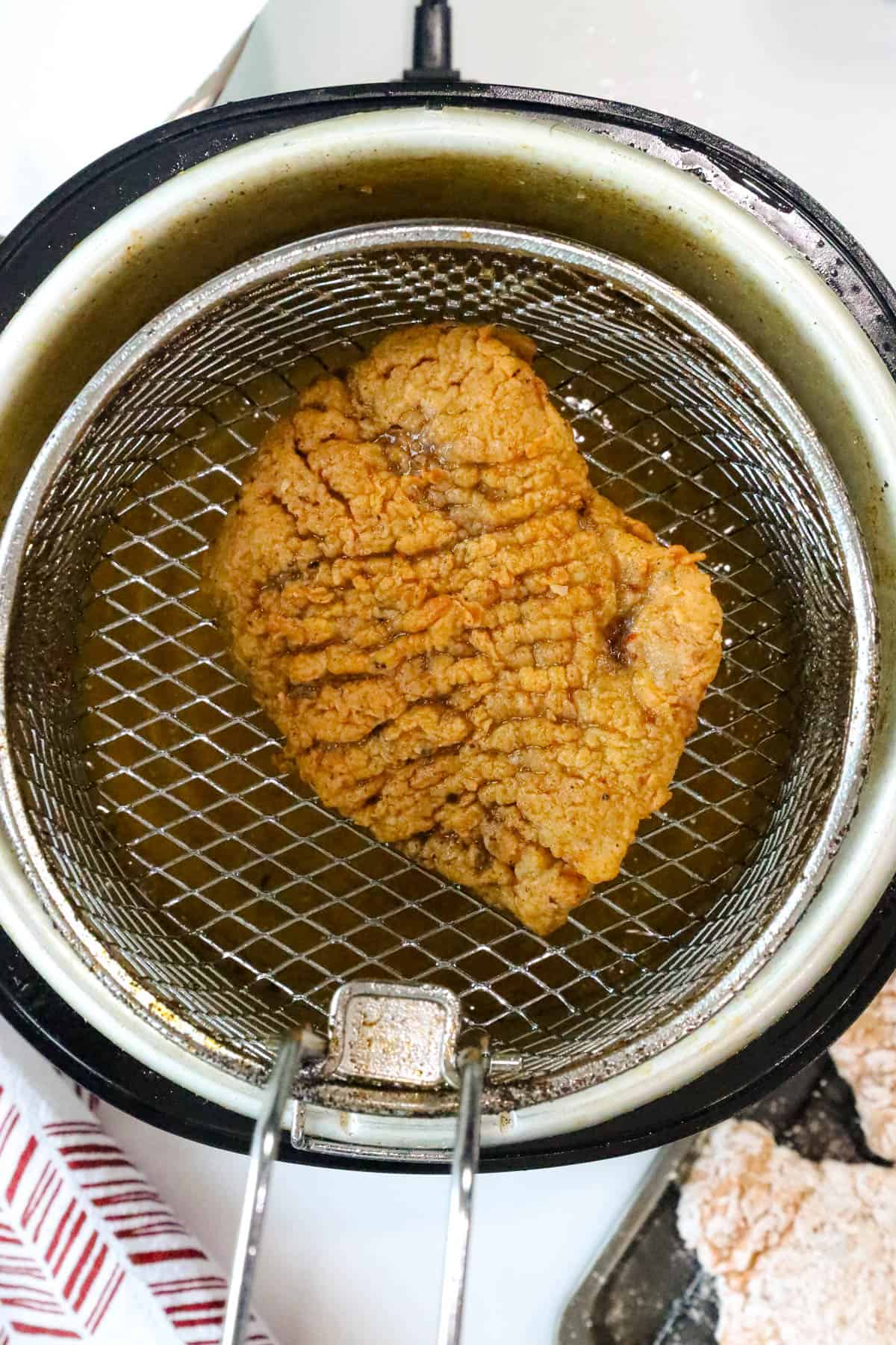 country fried steak in a bowl in frying basket