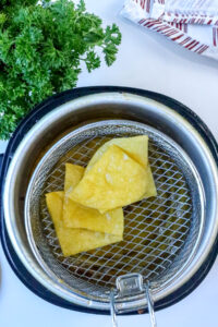 Crispy Homemade Tortilla Chips (10 Minute Recipe) in frying basket