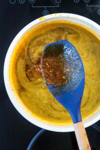 spoon lifting chipotle sauce