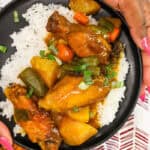 hands holding Air Fryer Curry Chicken