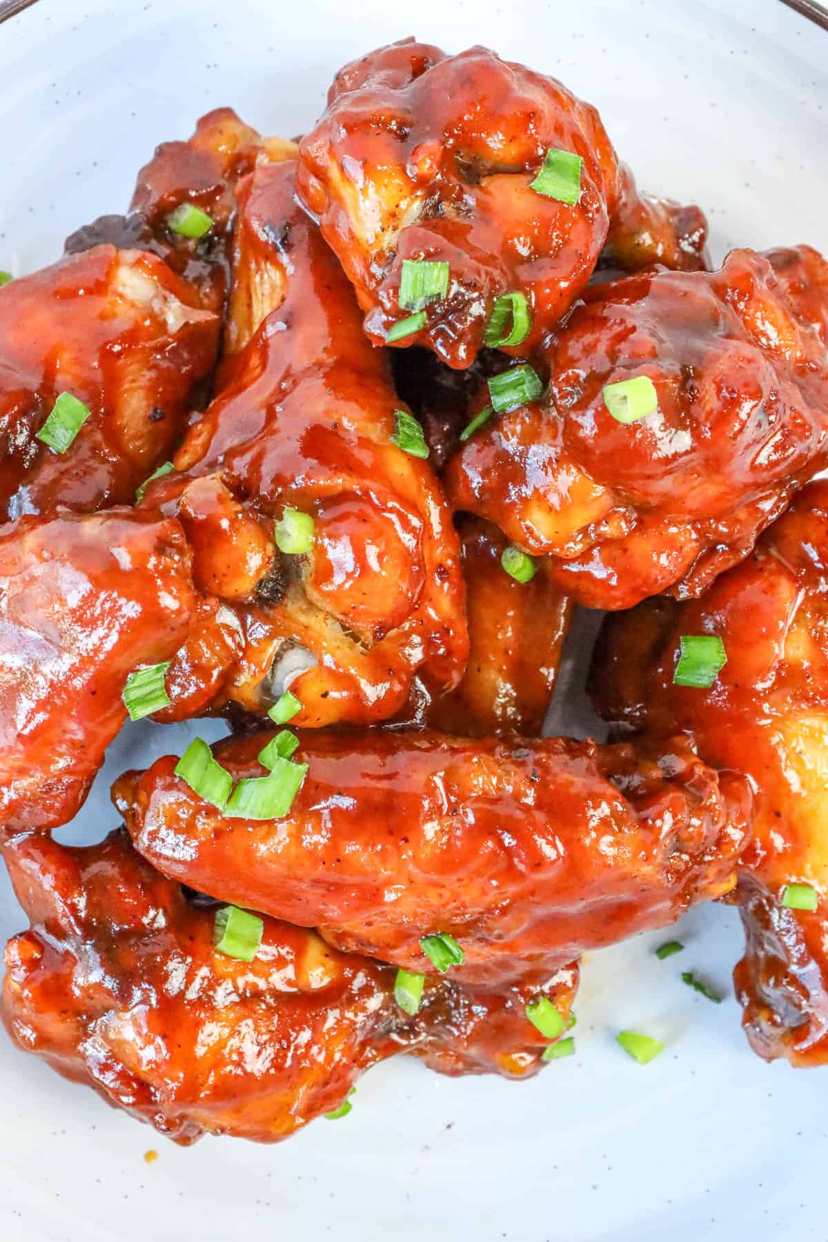 sticky bbq chicken wings topped with chives