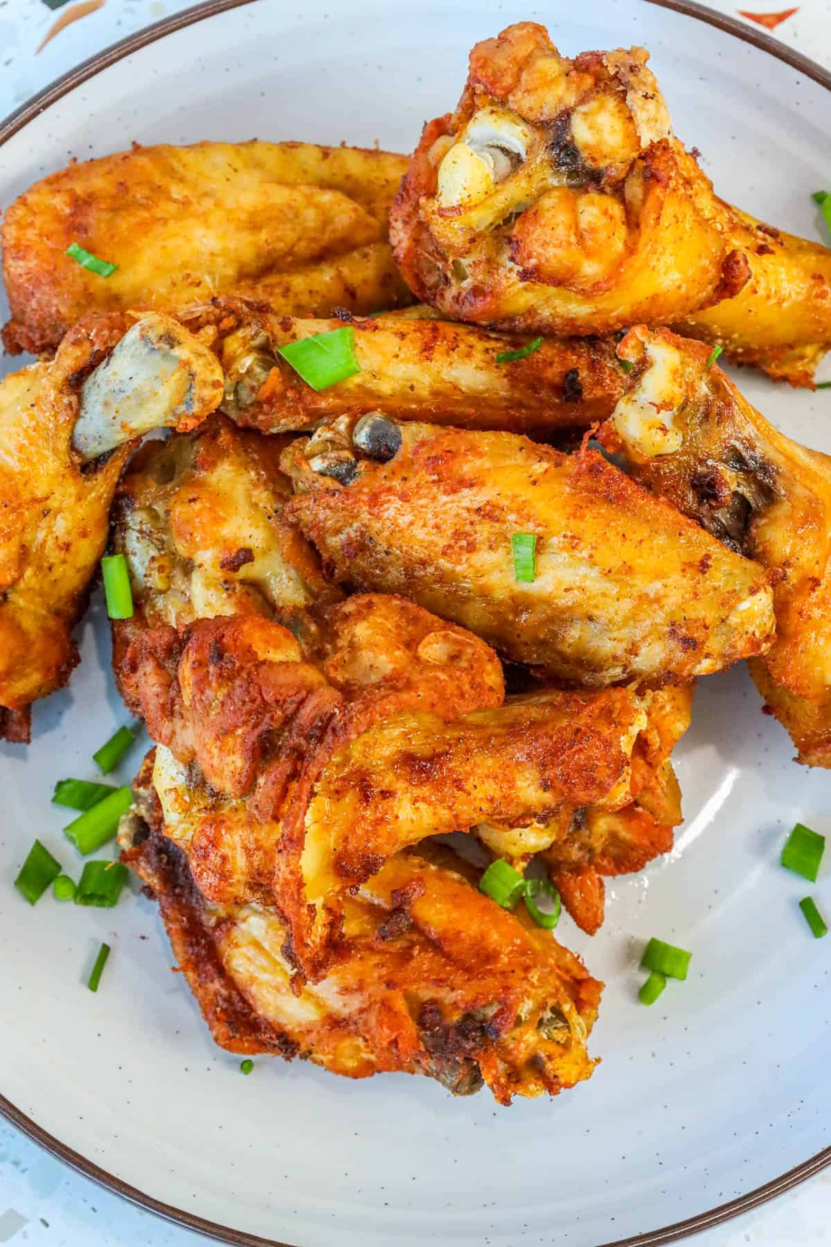 no breading deep fried wings topped with chives